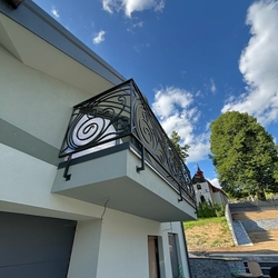 Designer wrought iron railing on the balcony of a family house Designer wrought iron railing on the balcony of a family house
