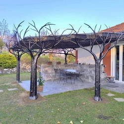 Design shelter on the terrace of a family house created by hand-forged trees