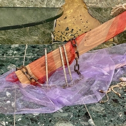 Wrought iron chain and nails with historical design near the cross in the church Wrought iron chain and nails with historical design near the cross in the church