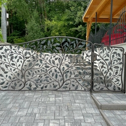 A designer gate hand-forged in the shape of oak branches at a family house in eastern Slovakia A designer gate hand-forged in the shape of oak branches at a family house in eastern Slovakia